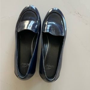 Navy patent leather slip ons.